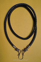 Leather necklace with bronze wolf heads