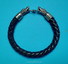 Leather bracelet with silver wolf heads